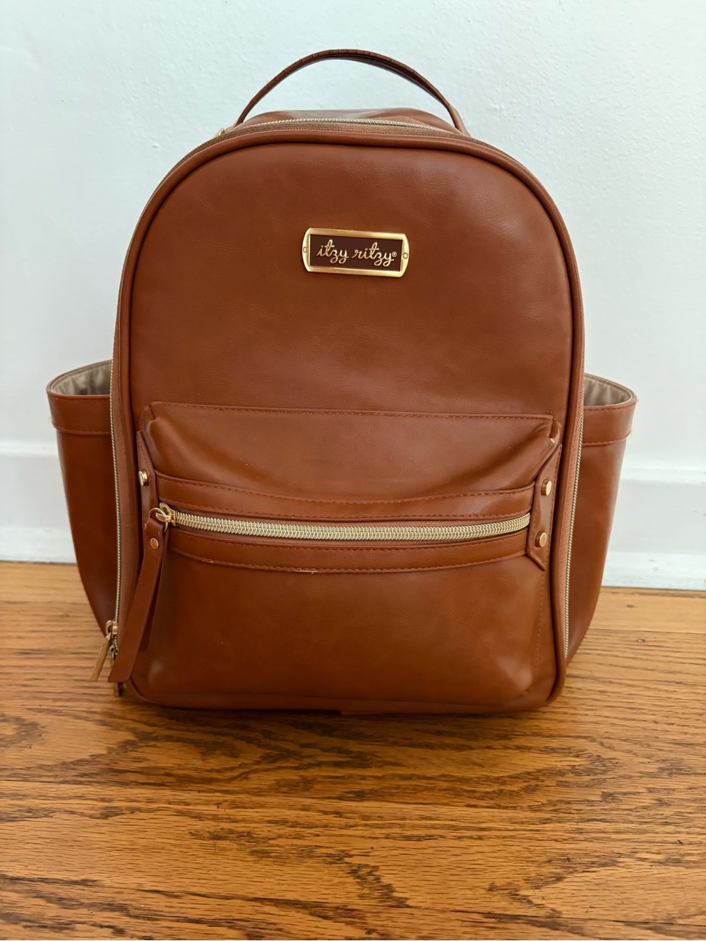 Itzy Ritzy Tan Vegan Leather Diaper Bag Backpack +Changing Pad with Gold Accents